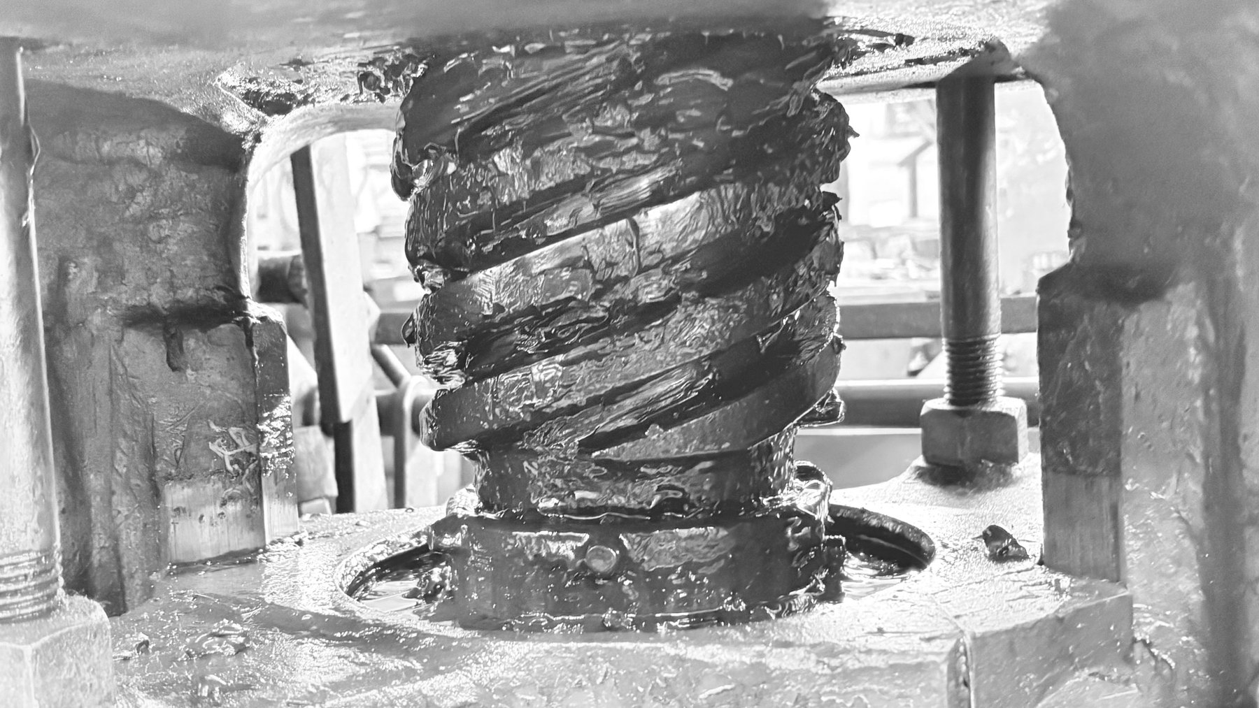 Close-up of press ram and tooling for cold forging work